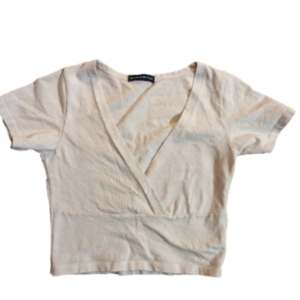 Brandy Melville pale pink crossover top